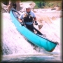 Canoeman running Chamblee Falls on the North Prong of the Medina River, Texas