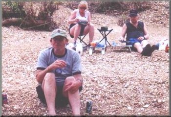 Winn Becton, Terri and Fraser Border eating lunch by the river