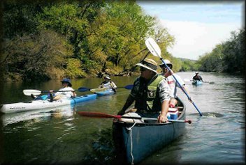 Roy Pipkin and Bryan Jackson talking with Carolee Doty
