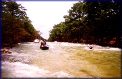 Marc running the rapids on the Blanco River, 2001