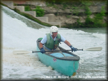Marc McCord sliding off the apron after running Martindale Dam