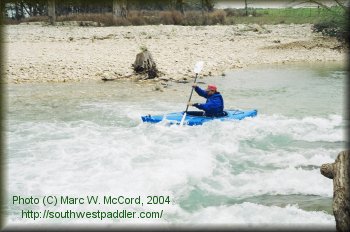 Steve running a small rapid